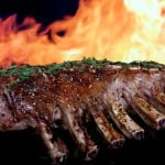 Silhouette of summer garden BBQ isolated against fire