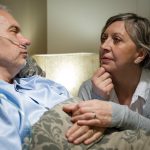 Senior patient at hospital with worried wife