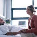 Wife,Visiting,Husband,In,Hospital.,Woman,Consoling,Hospitalised,Man.