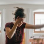 Blured,Photo,Of,A,Woman,Suffering,From,Vertigo,Or,Dizziness